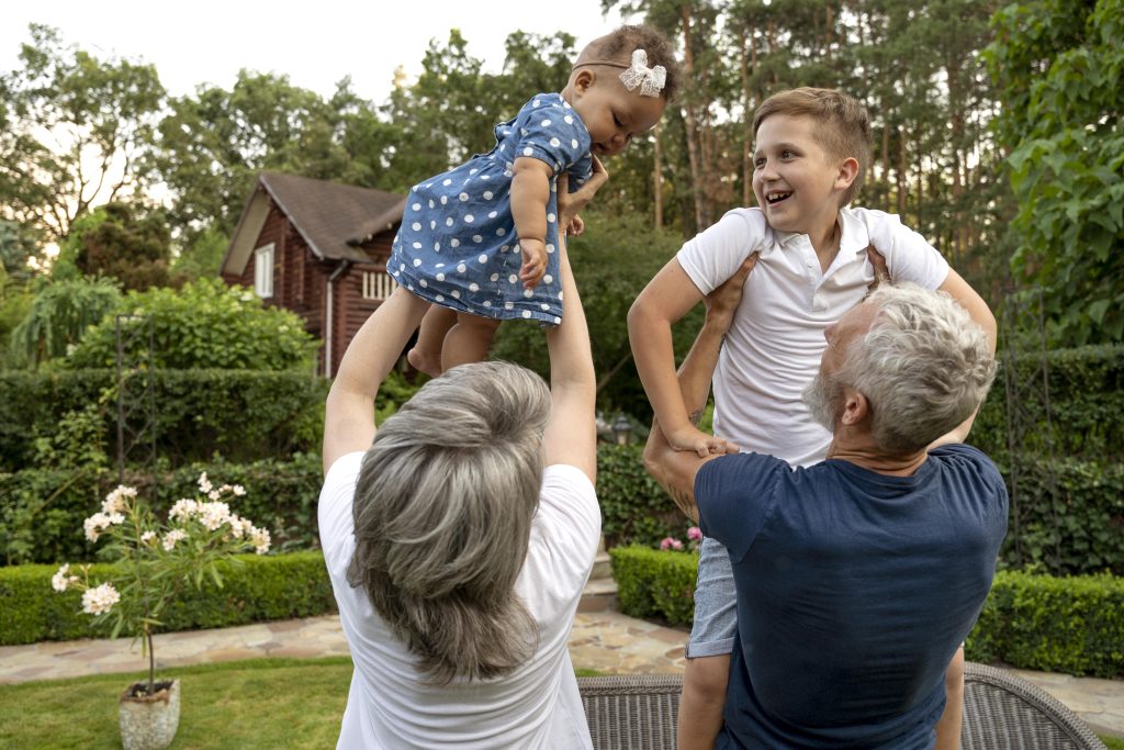 Grandparents holding grandchildren